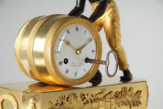 Antique clock with figurative depiction